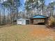 Property with multiple outbuildings with room for storage and hobbies on a spacious lot at 265 River Run Rd, Statesville, NC 28625