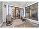 View of covered balcony area with outdoor seating and sliding glass doors at 2719 Selwyn Ave # 6, Charlotte, NC 28209