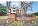 Attractive brick condo building featuring beautiful landscaping and manicured grounds at Oakmore at 2719 Selwyn Ave # 6, Charlotte, NC 28209