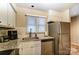 Bright kitchen with stainless steel appliances, granite countertops, and white cabinets at 2719 Selwyn Ave # 6, Charlotte, NC 28209