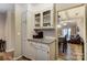 Kitchen area boasts white cabinets, granite countertops, and seamless transition to dining at 2719 Selwyn Ave # 6, Charlotte, NC 28209