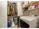 Efficient laundry room equipped with a washer and dryer, plus shelving for storing laundry essentials at 2719 Selwyn Ave # 6, Charlotte, NC 28209