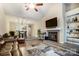Spacious living room with a fireplace, TV, and view into the kitchen at 2719 Selwyn Ave # 6, Charlotte, NC 28209