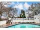 Community pool area with lounge chairs and brick paved deck at 2719 Selwyn Ave # 6, Charlotte, NC 28209