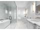 A luxurious bathroom boasts a freestanding tub, marble accents, and modern fixtures at 2818 Kenwood Sharon Ln, Charlotte, NC 28211