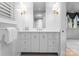 Bright bathroom featuring a white vanity with double drawers, modern fixtures, and a large mirror at 2818 Kenwood Sharon Ln, Charlotte, NC 28211
