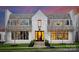 Stunning two-story home with a light brick exterior, complemented by black-framed windows at 2818 Kenwood Sharon Ln, Charlotte, NC 28211