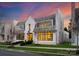 Elegant home showcasing its painted brick exterior, lush lawn, and black window frames at 2818 Kenwood Sharon Ln, Charlotte, NC 28211