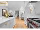 A view of the luxury kitchen showcasing hardwood floors, marble backsplash and high-end gas range at 2818 Kenwood Sharon Ln, Charlotte, NC 28211