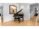 Bright Living room with a piano and hardwood floors at 2818 Kenwood Sharon Ln, Charlotte, NC 28211