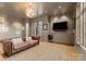 Cozy living room features a comfortable sofa, modern lighting, and built-in bar at 2818 Kenwood Sharon Ln, Charlotte, NC 28211