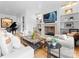 Spacious living room featuring a fireplace, hardwood floors, and piano at 2818 Kenwood Sharon Ln, Charlotte, NC 28211