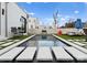 Modern backyard featuring a sleek pool, comfortable lounge seating, and stylish patio furniture for outdoor enjoyment at 2818 Kenwood Sharon Ln, Charlotte, NC 28211