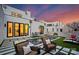 Backyard oasis with a sleek pool, comfortable seating, and manicured artificial turf at 2818 Kenwood Sharon Ln, Charlotte, NC 28211