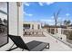 Relaxing rooftop patio with sleek chaise lounge, comfortable seating, and neighborhood views on a sunny day at 2818 Kenwood Sharon Ln, Charlotte, NC 28211
