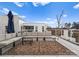 Spacious rooftop patio with comfortable lounge seating and outdoor rug against a backdrop of blue sky at 2818 Kenwood Sharon Ln, Charlotte, NC 28211