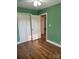 Bedroom featuring a closet and hardwood flooring at 2921 Fort St, Charlotte, NC 28205
