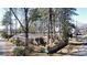 Cozy brick house with a quaint front porch, fenced backyard, and beautiful natural surroundings at 2921 Fort St, Charlotte, NC 28205