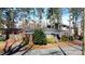 Quaint brick home featuring an inviting entrance and lush greenery at 2921 Fort St, Charlotte, NC 28205