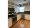 Kitchen featuring stainless steel appliances, and white cabinets at 2921 Fort St, Charlotte, NC 28205