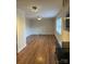 View of kitchen with stainless steel appliances, wood floors, and neutral wall paint at 2921 Fort St, Charlotte, NC 28205
