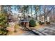 Residential street view of a charming brick home with mature trees creating a canopy at 2921 Fort St, Charlotte, NC 28205