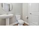 Bathroom featuring pedestal sink, toilet, and tile floors at 2934 Hiddenbrook Way, Fort Mill, SC 29707