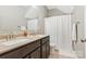 Bathroom featuring double sink vanity and shower with curtain at 2934 Hiddenbrook Way, Fort Mill, SC 29707