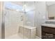 Bathroom featuring tiled shower with glass door and granite vanity at 2934 Hiddenbrook Way, Fort Mill, SC 29707