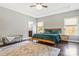 Primary bedroom with a tray ceiling, two windows, and an ensuite bathroom at 2934 Hiddenbrook Way, Fort Mill, SC 29707