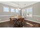 Elegant dining room with a round table, stylish chairs, and natural light streaming through the windows at 2934 Hiddenbrook Way, Fort Mill, SC 29707