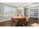Elegant dining room with a round table, stylish chairs, and natural light streaming through the windows at 2934 Hiddenbrook Way, Fort Mill, SC 29707