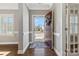 Inviting entryway with dark hardwood floors, a decorative rug, and a view of the front yard at 2934 Hiddenbrook Way, Fort Mill, SC 29707
