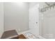 Hallway featuring tile floor, entryway, and mounted coat rack at 2934 Hiddenbrook Way, Fort Mill, SC 29707