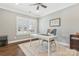 Bright home office featuring glass doors, plantation shutters and a neutral color scheme at 2934 Hiddenbrook Way, Fort Mill, SC 29707