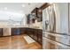 Well-equipped kitchen with stainless steel refrigerator and ample cabinet space for storage at 2934 Hiddenbrook Way, Fort Mill, SC 29707