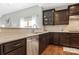 The kitchen features stainless steel dishwasher and granite countertops and tiled backsplash at 2934 Hiddenbrook Way, Fort Mill, SC 29707