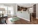 Bright kitchen nook with hardwood floors, granite counters, and open view into updated kitchen at 2934 Hiddenbrook Way, Fort Mill, SC 29707