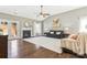 Spacious living room with fireplace, ceiling fan, and French doors leading to the outside at 2934 Hiddenbrook Way, Fort Mill, SC 29707