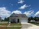 Charming single-Gathering home boasting craftsman-style architecture and a well-manicured front lawn at 305 Basil Dr, Indian Trail, NC 28079