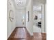 Inviting foyer with wood floors, a statement mirror, and an open view into the home office at 305 Basil Dr, Indian Trail, NC 28079
