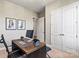 Home office space with a rustic desk and ample storage options with large double doors at 305 Basil Dr, Indian Trail, NC 28079