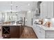 Modern kitchen with white cabinets, stainless steel appliances, and a kitchen island at 305 Basil Dr, Indian Trail, NC 28079