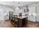 Modern kitchen with white cabinetry, stainless steel appliances, and granite countertops at 305 Basil Dr, Indian Trail, NC 28079