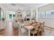 Open-concept dining and living area with hardwood floors and a fireplace at 305 Basil Dr, Indian Trail, NC 28079
