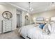 Main bedroom with a chandelier, carpet floors, dressers, and natural light at 305 Basil Dr, Indian Trail, NC 28079
