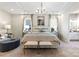 Spacious main bedroom featuring a tray ceiling, chandelier, and ensuite bathroom at 305 Basil Dr, Indian Trail, NC 28079