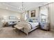 Bright main bedroom with a seating area, chandelier, and plenty of natural light at 305 Basil Dr, Indian Trail, NC 28079