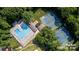 Aerial view of community pool and tennis courts surrounded by lush greenery at 3200 Highview Rd, Charlotte, NC 28210