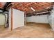 Unfinished basement with concrete floor, exposed ceiling, and utility connections at 3200 Highview Rd, Charlotte, NC 28210